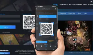 Telefon skanuje kod QR Steam na ekranie komputera, aby się zalogować.